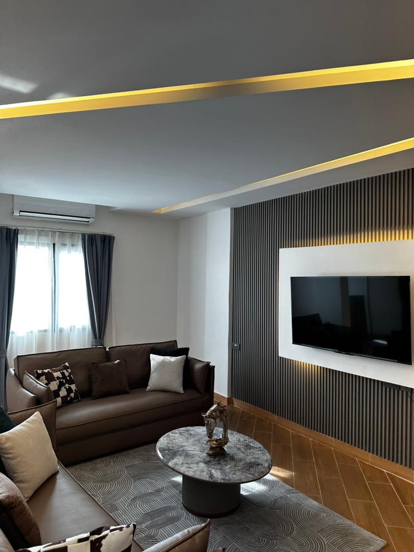 Executive suite interior with gold accents and dark wood